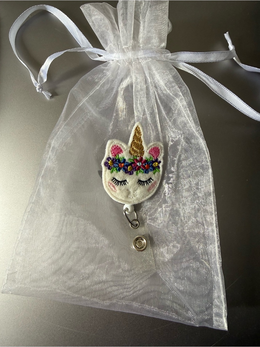 Handmade embroidered felt unicorn badge reel